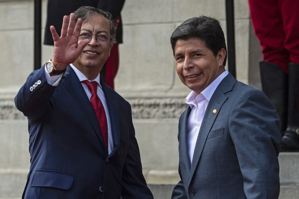 Colombian President Gustavo Petro (left) and Peruvian President Pedro Castillo (right) gesture before a meeting at the Government Palace in Lima, on August 29, 2022. (Photo by ERNESTO BENAVIDES / AFP)