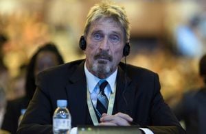 Founder of the first commercial anti-virus program that bore his name, John David McAfee listens during the 4th China Internet Security Conference (ISC) in Beijing, Tuesday, Aug. 16, 2016. Despite China's tight controls on the flow of information on the internet, online fraud and identity theft are posing major challenges to authorities as e-commerce and other online services boom. Chinese characters at top reads "Enterprise Safety Leader" (AP Photo/Ng Han Guan)