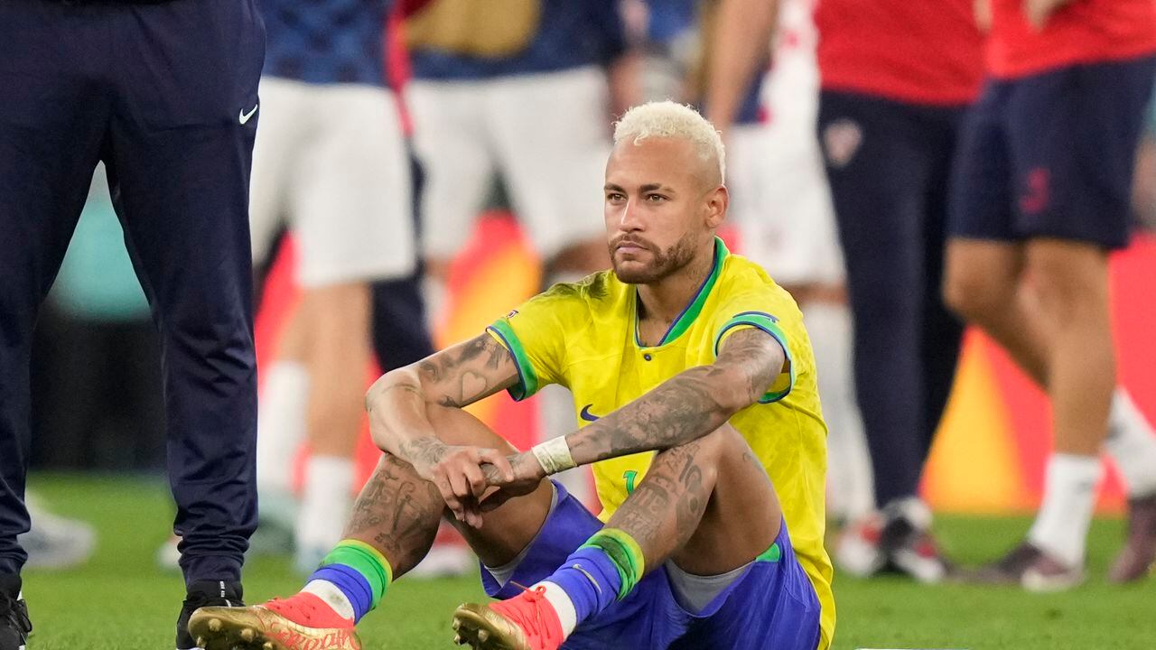 Brazil's Neymar sits on the pitch at the end of the World Cup quarterfinal soccer match between Croatia and Brazil, at the Education City Stadium in Al Rayyan, Qatar, Friday, Dec. 9, 2022. (AP Photo/Darko Bandic)