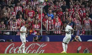 FILE - Real Madrid's Rodrygo, left, celebrates after scoring with his teammate Real Madrid's Vinicius Junior the opening goal during the Spanish La Liga soccer match between Atletico Madrid and Real Madrid at the Wanda Metropolitano stadium in Madrid, Spain, Sept. 18, 2022. With a goal and a dance, Real Madrid's young Brazilian forwards made a strong statement against racism in soccer this weekend. With their samba-like moves after a goal in the derby against Atletico on Sunday, Rodrygo and Vinícius Junior made it clear they are not backing down. (AP Photo/Manu Fernandez)