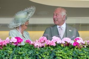 King Charles III and Queen Camilla celebrate after the King's horse, Desert Hero, ridden by Tom Marquand wins the King George V Stakes during day three of Royal Ascot at Ascot Racecourse, Berkshire. Picture date: Thursday June 22, 2023. (Photo by Jonathan Brady/PA Images via Getty Images)