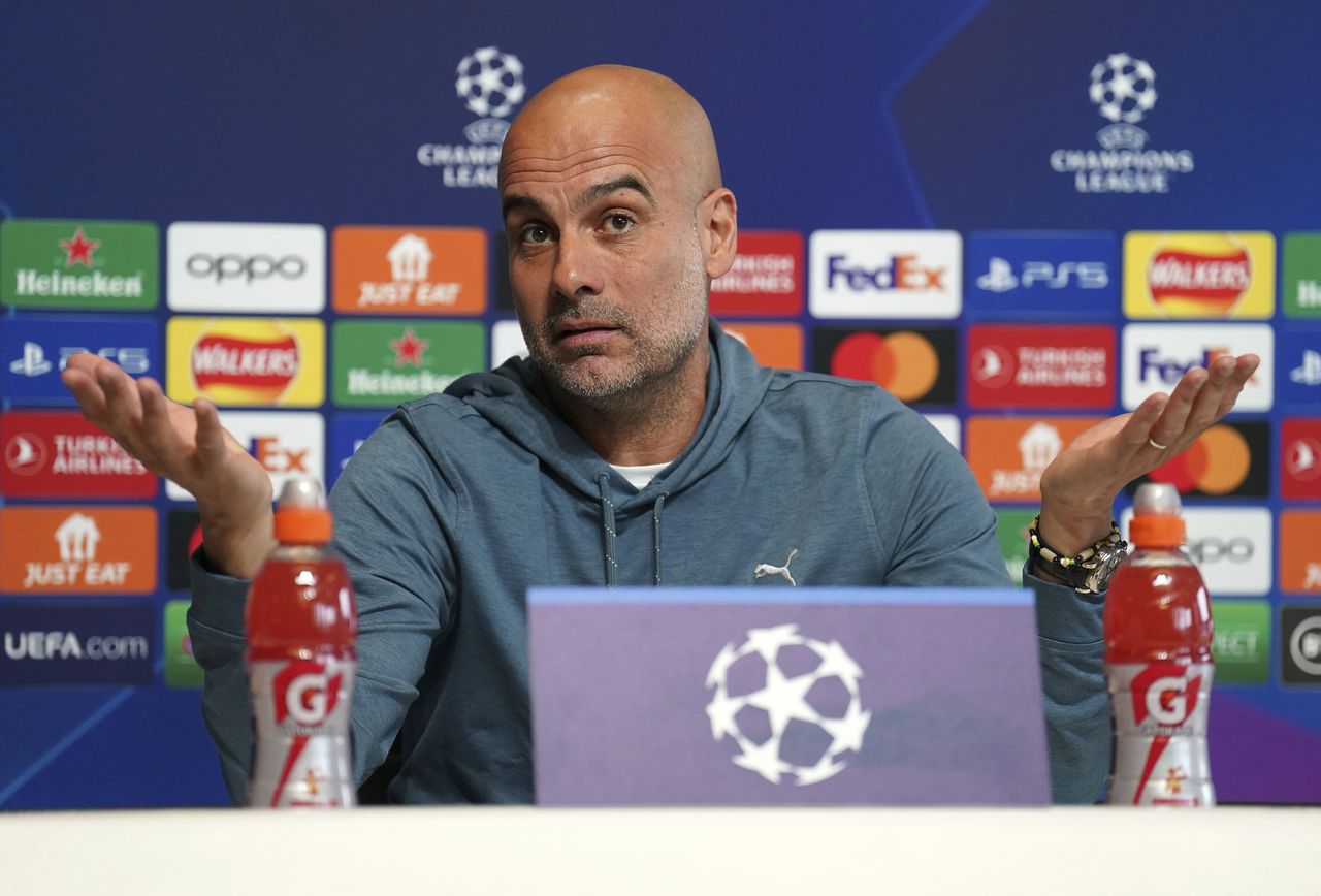 Manchester City manager Pep Guardiola gestures during a press conference at the City Football Academy, Manchester, Britain, ahead of their Champions League quarterfinal soccer match with Bayern Munich, Monday, April 10, 2023. (Mike Egerton/PA via AP)