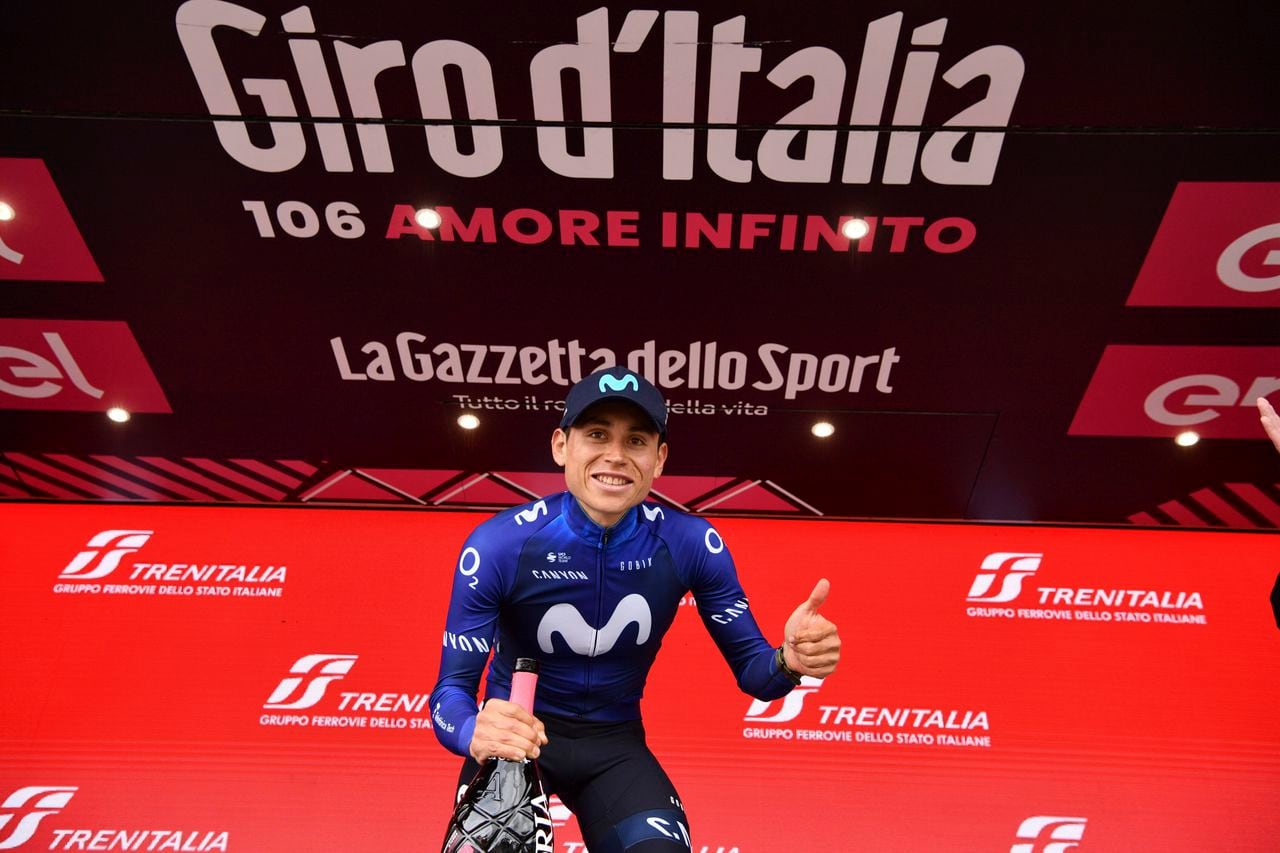 Colombia's Einer Rubio Reyes poses on podium after winning the 13rd stage of the Giro D'Italia, tour of Italy cycling race, from Borgofranco D'Ivrea to Crans Montana, Friday, May 19, 2023. (Massimo Paolone/LaPresse via AP)