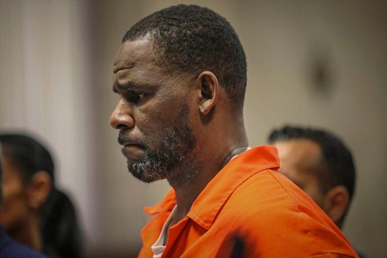 FILE – In this photo, R. Kelly during a hearing at the Leighton Criminal Court in Chicago.  The trial of R. Kelly, who for years evaded charges of abuse against women and minors, began Wednesday, Aug. 18, 2021. (Antonio Perez/Chicago Tribune via AP, Pool, File)