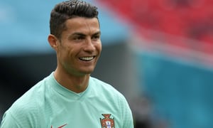 Portugal's Cristiano Ronaldo smiles during a team training session at the Ferenc Puskas stadium in Budapest, Monday, June 14, 2021 the day before the Euro 2020 soccer championship group F match between Hungary and Portugal. (AP Photo/Darko Bandic)