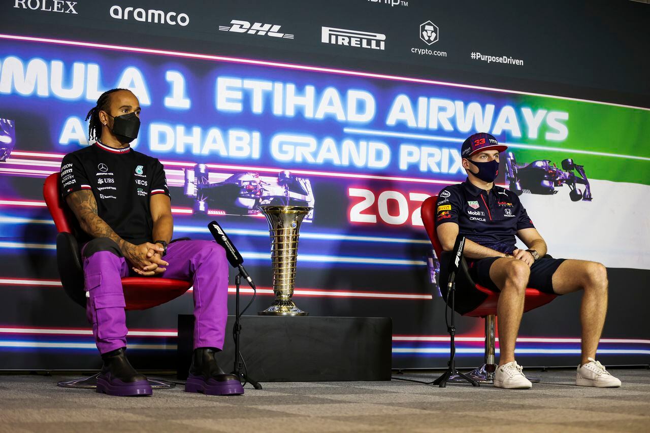 Mercedes driver Lewis Hamilton of Britain, let, and Red Bull driver Max Verstappen of the Netherlands speak during a press conference ahead of the Formula One Abu Dhabi Grand Prix in Abu Dhabi, United Arab Emirates, Thursday, Dec. 9, 2021. (Antonin Vincent, Pool vía AP)