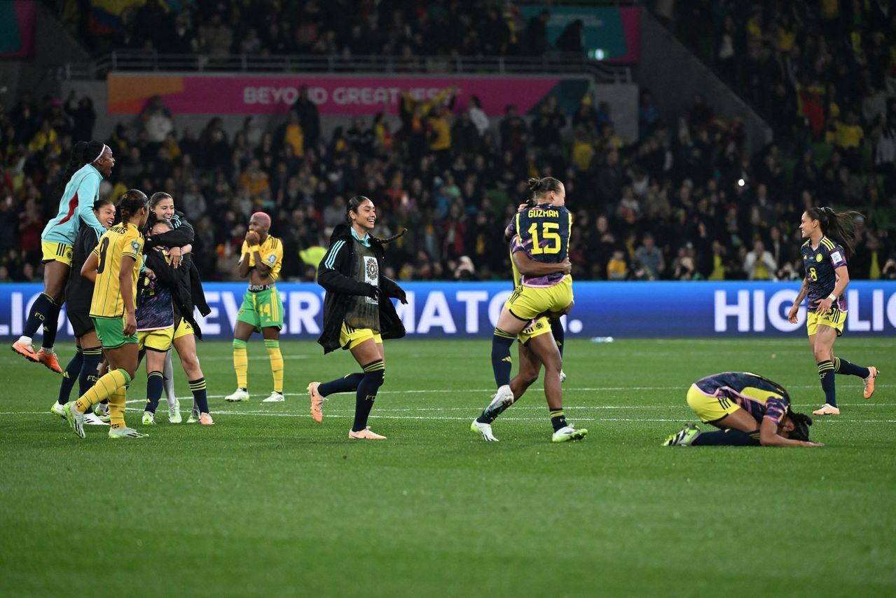 Players react at the end of the Australia and New Zealand 2023 Women's World Cup round of 16 football match between Jamaica and Colombia at Melbourne Rectangular Stadium, also known as AAMI Park, in Melbourne on August 8, 2023. (Photo by WILLIAM WEST / AFP)