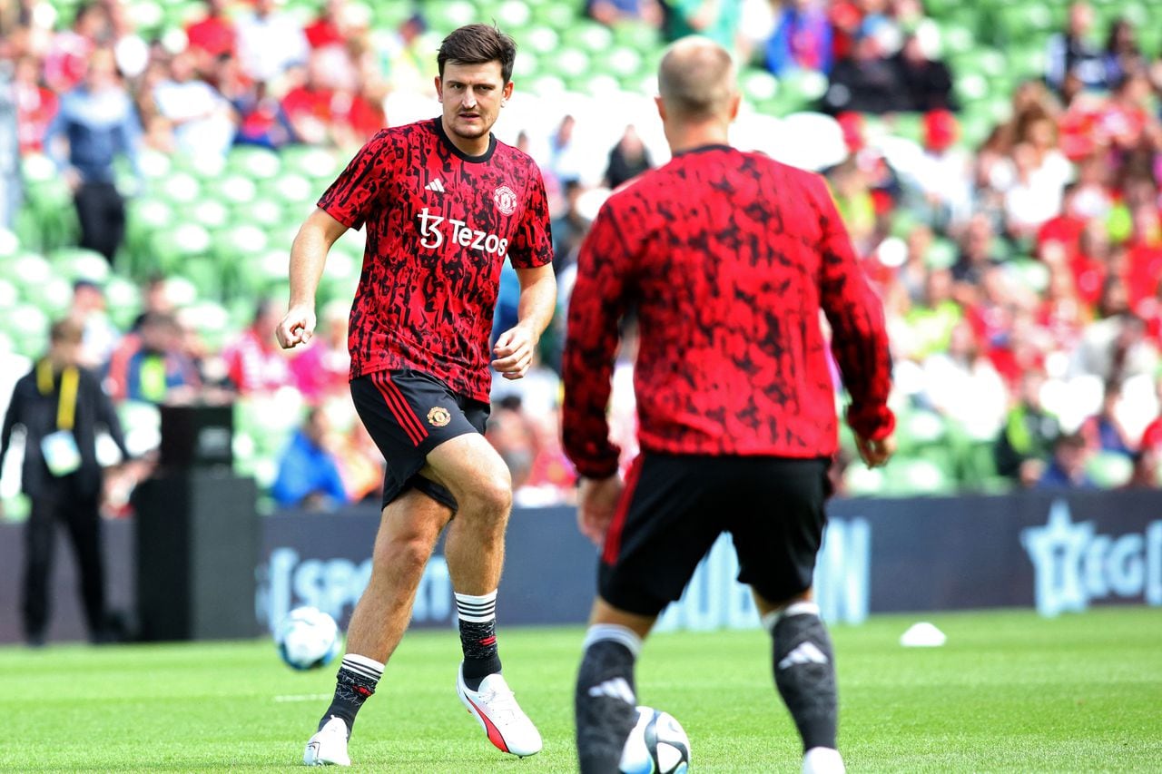 Manchester United's English defender Harry Maguire warms up ahead of the pre-season friendly football match between Manchester United and Athletic Club Bilbao at the Aviva Stadium, in Dublin, on August 6, 2023. (Photo by Paul Faith / AFP)