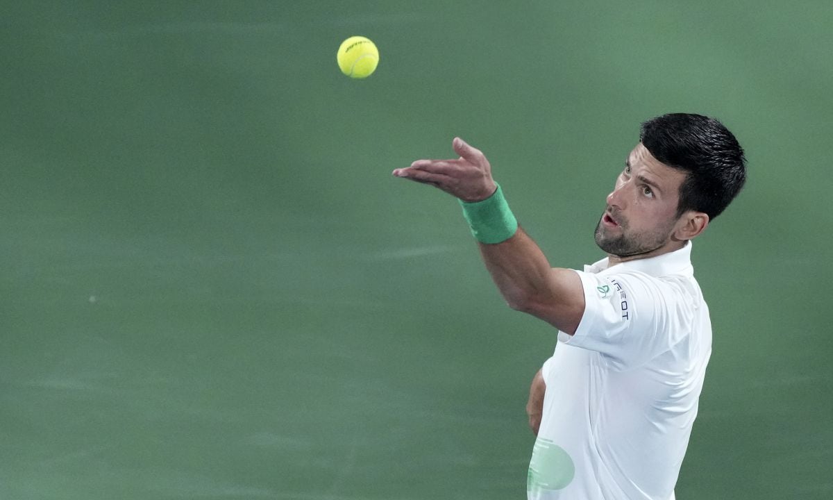 Serbia's Novak Djokovic serves to Czech Republic's Jiri Vesely during a match at the Dubai Duty Free Tennis Championship in Dubai, United Arab Emirates, Thursday, Feb. 24, 2022. (AP/Ebrahim Noroozi)