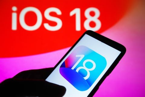 UKRAINE - 2023/09/22: In this photo illustration, iOS 18 logo is seen on a smartphone and on a pc screen in the background. (Photo Illustration by Pavlo Gonchar/SOPA Images/LightRocket via Getty Images)