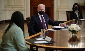 US President Joe Biden takes part in a roundtable discussion on the Covid relief  �American Rescue� plan as Alma Williams (L), and Lyda Vanegas (R), look on in the State Dining Room of the White House in Washington, DC on March 5, 2021. (Photo by MANDEL NGAN / AFP)