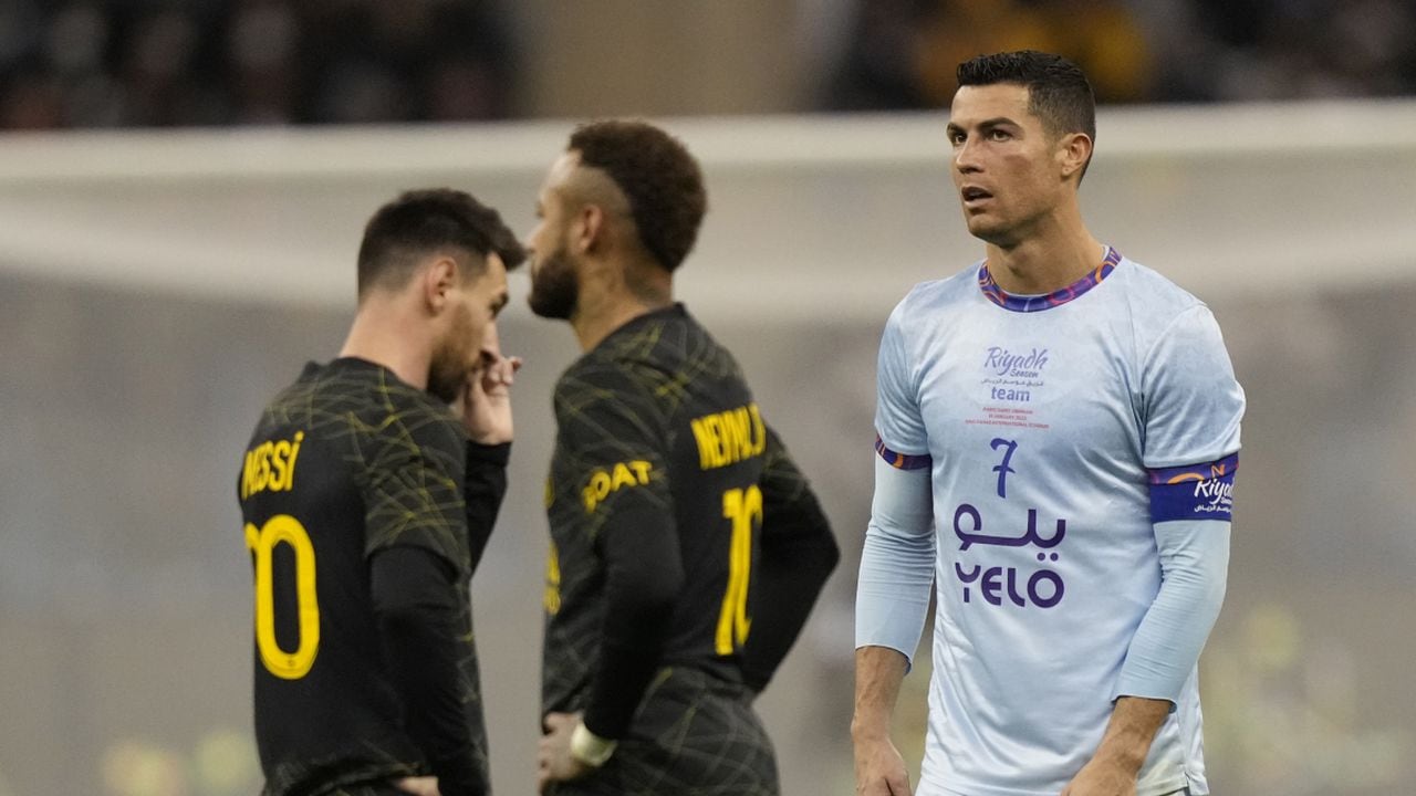 Cristiano Ronaldo playing for a combined XI of Saudi Arabian teams Al Nassr and Al Hilal is flanked by PSG's Lionel Messi and his teammate Neymar during a friendly soccer match, at the King Saud University Stadium, in Riyadh, Saudi Arabia, Thursday, Jan. 19, 2023. (AP/Hussein Malla)