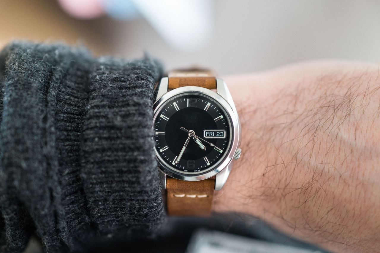 What with Black Dial and leather strap