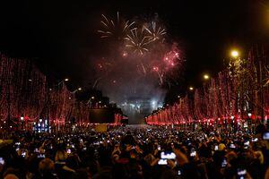 Fireworks explode over the Arc de Triomphe on the Champs-Elysees for New Year's celebrations in the French capital Paris on January 1, 2019. A fireworks display and sound and light show under the theme &quot;fraternity&quot; is set to go ahead on the Champs-Elysees despite plans for further &quot;yellow vest&quot; anti-government protests at the famed avenue. (Photo by Sameer Al-Doumy/NurPhoto via Getty Images)