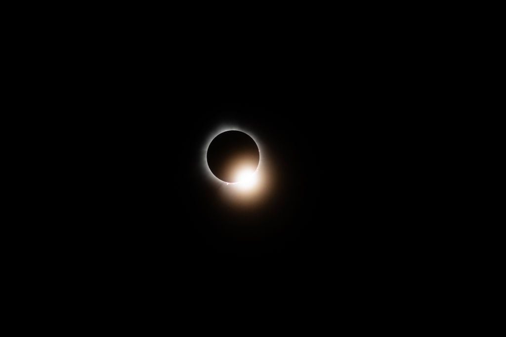 WAPAKONETA, OHIO - APRIL 8: The sun and the moon align completely during the total solar eclipse on April 8, 2024 in Wapakoneta, Ohio. Totality lasted for alomst four minutes in Ohio. Millions of people have flocked to areas across North America that are in the "path of totality" in order to experience a total solar eclipse. During the event, the moon will pass in between the sun and the Earth, appearing to block the sun. (Photo by Matthew Hatcher/Getty Images)