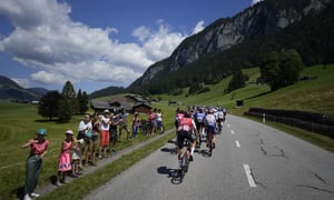 The pack rides during the ninth stage of the Tour de France cycling race over 193 kilometers (119.9 miles) with start in Aigle, Switzerland and finish in Chatel les Portes du Soleil, France, Sunday, July 10, 2022. (AP/Thibault Camus)