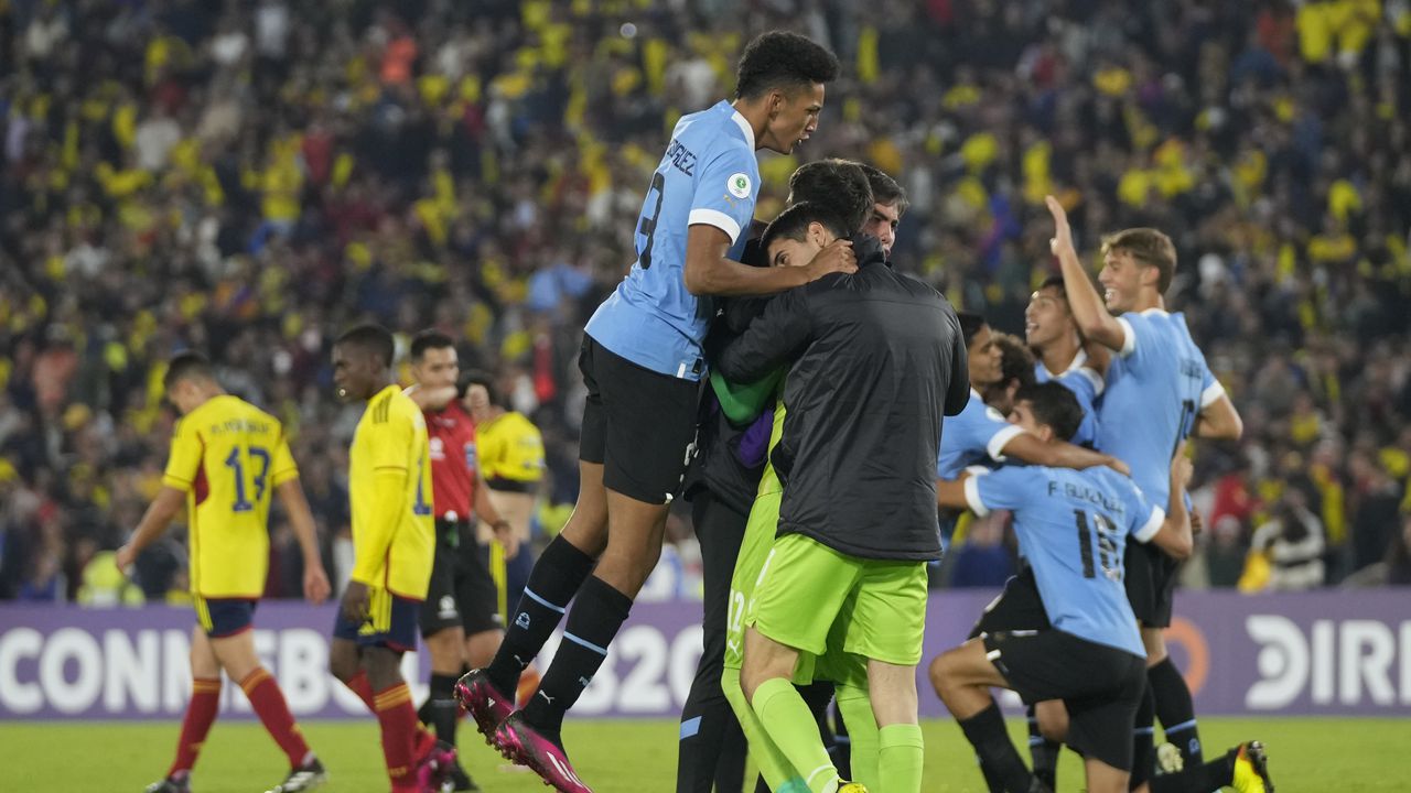 Uruguayan players celebrate at the end of a South America U-20 Championship soccer match against Colombia in Bogota, Colombia, Tuesday, Jan. 31, 2023. Uruguay won 1-0. (AP Photo/Fernando Vergara)