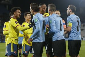 Uruguay and Colombia players argue with each other during a qualifying soccer match for the FIFA World Cup Qatar 2022 in Montevideo, Uruguay, Thursday, Oct. 7, 2021. (Andres Cuenca/Pool via AP)