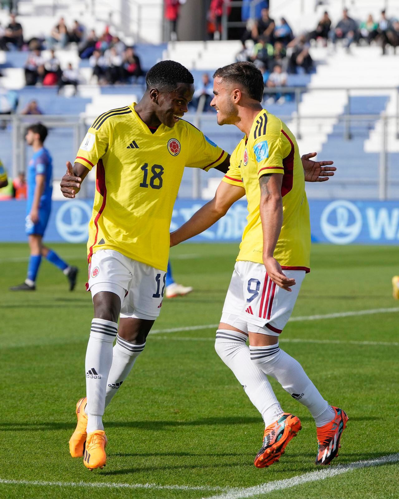 Colombia's Tomas Angel, right, is congratulated after scoring his side's 3rd goal against Slovakia during a FIFA U-20 World Cup round of 16 soccer match at the Bicentenario stadium in San Juan, Argentina, Wednesday, May 31, 2023. (AP Photo/Ricardo Mazalan)
