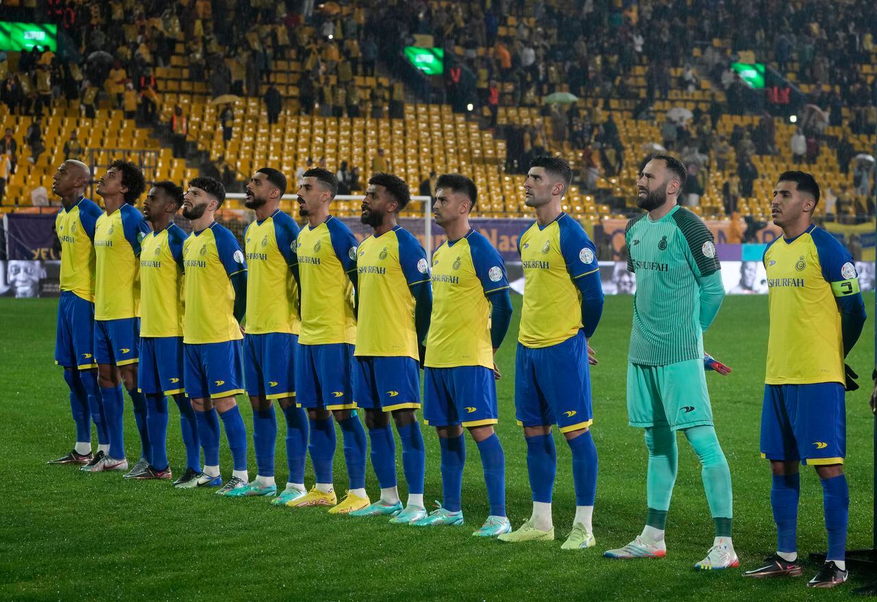Cristiano Ronaldo's team، Al Nassr, greet National Anthem during the team match against Al Tai on the Saudi League at Marsool Park in Riyadh, Saudi Arabia, Friday, Jan. 6, 2023. Ronaldo, who has won five Ballon d'Ors awards for the best soccer player in the world and five Champions League titles, will play outside of Europe for the first time in his storied career. (AP Photo/Amr Nabil)