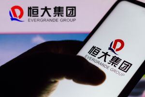BRAZIL - 2021/09/22: In this photo illustration the Evergrande Group logo seen displayed on a smartphone. (Photo Illustration by Rafael Henrique/SOPA Images/LightRocket via Getty Images)