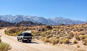 Truck with a Canoe on a Dirt Road in Owens Valley