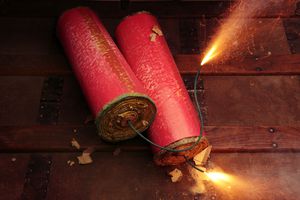 two burning firecrackers