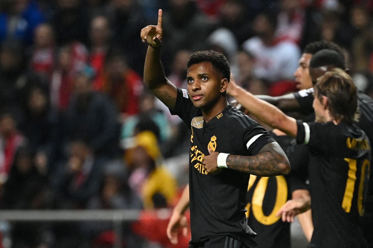 Real Madrid's Brazilian forward #11 Rodrygo celebrates after scoring his team's first goal during the UEFA Champions League 1st round day 3 Group C football match between SC Braga and Real Madrid CF at the Municipal stadium of Braga on October 24, 2023. (Photo by MIGUEL RIOPA / AFP)