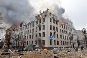 Firefighters work to contain a fire at the Economy Department building of Karazin Kharkiv National University, allegedly hit during recent shelling by Russia, on March 2, 2022. (Photo by Sergey BOBOK / AFP)
