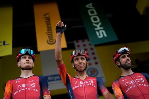 Colombia's Egal Bernal, center, and Spain's Carlos Rodriguez, left, greet spectators prior to the start of the second stage of the Tour de France cycling race over 209 kilometers (130 miles) with start in Vitoria Gasteiz and finish in San Sebastian, Spain, Sunday, July 2, 2023. (AP Photo/Thibault Camus)