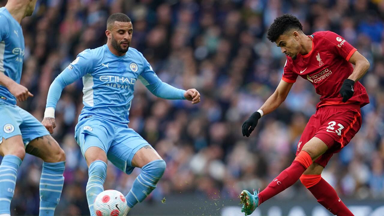 Liverpool's Luis Diaz, right, kicks the ball during the English Premier League soccer match between Manchester City and Liverpool, at the Etihad stadium in Manchester, England, Sunday, April 10, 2022. (AP Photo/Jon Super)