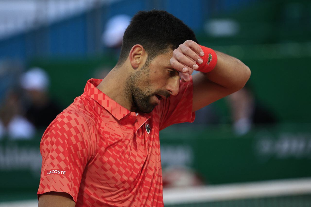Serbia's Novak Djokovic reacts during his match against Italy's Lorenzo Musetti at the  Monte-Carlo ATP Masters Series tournament round of 16 tennis match in Monte Carlo on April 13, 2023. (Photo by Valery HACHE / AFP)
