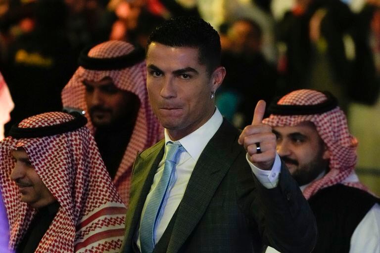 Cristiano Ronaldoreacts during his official unveiling as a new member of Al Nassr soccer club in in Riyadh, Saudi Arabia, Tuesday, Jan. 3, 2023.Ronaldo, who has won five Ballon d'Ors awards for the best soccer player in the world and five Champions League titles, will play outside of Europe for the first time in his storied career. (AP Photo/Amr Nabil)