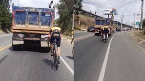 Tom Dumoulin detrás de un vehículo de carga en las afueras de Medellín