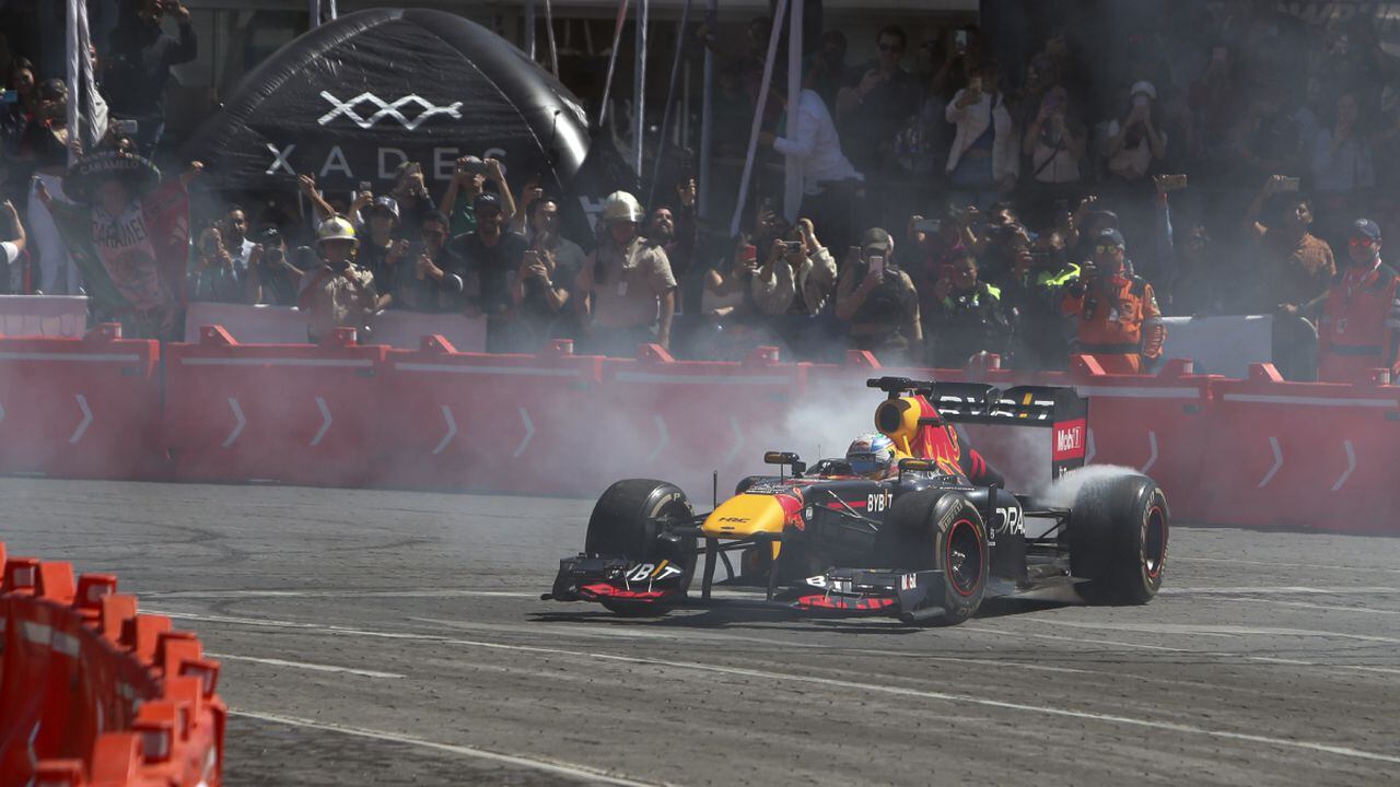 Mexican Formula One Red Bull driver Sergio "Checo" Perez drives in an exhibition race through the streets of Guadalajara, Mexico, Tuesday, Oct. 25, 2022. Perez will compete in the upcoming Mexico Grand Prix in Mexico City. (AP)