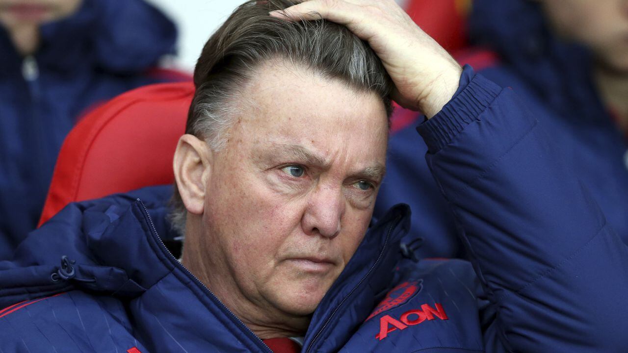 FILE - Manchester United's manager Louis van Gaal adjusts his hair as he waits for the start of the English Premier League soccer match between Sunderland and Manchester United at the Stadium of Light, Sunderland, England, Saturday, Feb. 13, 2016. Netherlands soccer coach Louis van Gaal has revealed that he is being treated for an aggressive form of prostate cancer but still plans to lead the team at the World Cup in Qatar in November. (AP/Scott Heppell)