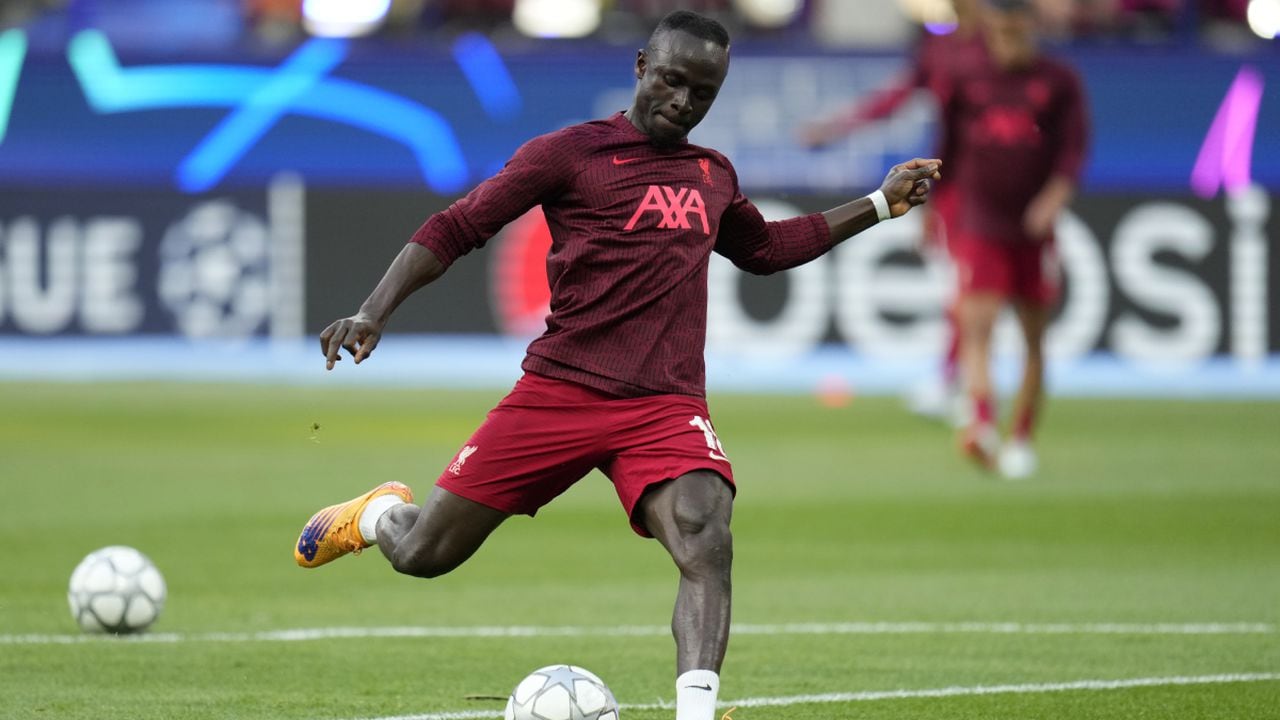 Liverpool's Sadio Mane takes a shot during warmup before the Champions League final soccer match between Liverpool and Real Madrid at the Stade de France in Saint Denis near Paris, Saturday, May 28, 2022. (AP Photo/Manu Fernandez)