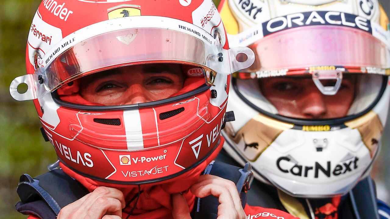 Ferrari driver Charles Leclerc of Monaco, left, walks past Red Bull driver Max Verstappen of the Netherlands after they respectively clocked the second and first fastest time during a sprint race at the Enzo and Dino Ferrari racetrack, in Imola, Italy, Saturday, April 23, 2022. The Italy's Emila Romagna Formula One Grand Prix will be held on Sunday.(Guglielmo Mangiapane, Pool via AP)