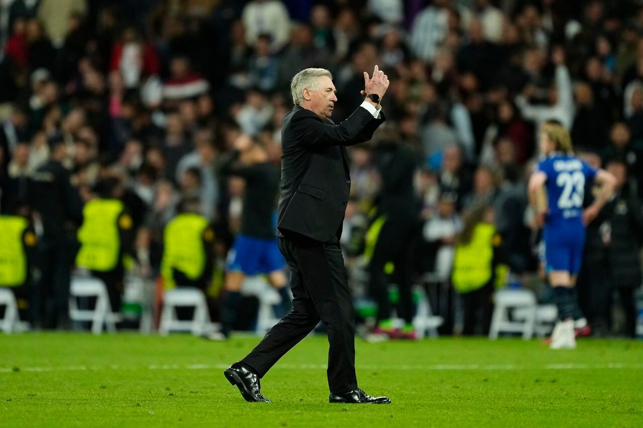 Real Madrid's head coach Carlo Ancelotti gestures to supporters at the end of the Champions League quarter final first leg soccer match between Real Madrid and Chelsea at Santiago Bernabeu stadium in Madrid, Wednesday, April 12, 2023. Real Madrid won 2-0. (AP Photo/Jose Breton)