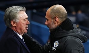 MANCHESTER, ENGLAND - JANUARY 01: Carlo Ancelotti, Manager of Everton speaks with Pep Guardiola, Manager of Manchester City ahead of the Premier League match between Manchester City and Everton FC at Etihad Stadium on January 01, 2020 in Manchester, United Kingdom. (Photo by Clive Brunskill/Getty Images)