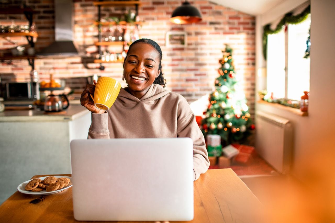 Close up of a young woman using a laptop during Christmas
