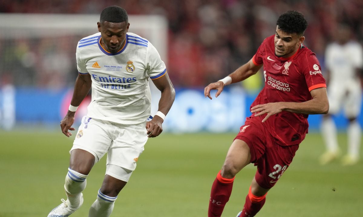 Real Madrid's David Alaba, left, is challenged by Liverpool's Luis Diaz during the Champions League final soccer match between Liverpool and Real Madrid at the Stade de France in Saint Denis near Paris, Saturday, May 28, 2022. (AP/Kirsty Wigglesworth)