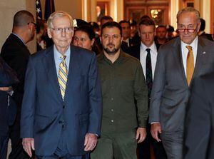 Ukrainian President Volodymyr Zelenskiy is escorted by U.S. Senate Minority Leader Mitch McConnell (R-KY) and Senate Majority Leader Chuck Schumer (D-NY) as he arrives to meet with all members of the Senate on a visit to the U.S. Capitol in Washington, September 21, 2023. REUTERS/Evelyn Hockstein