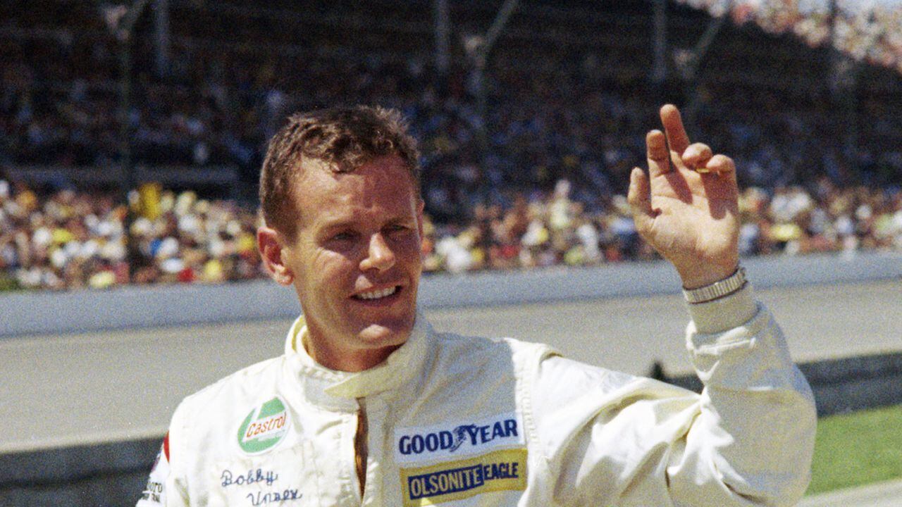 FILE - Auto racer Bobby Unser is shown at the Indianapolis 500 auto race in Indianapolis, Ind., in this May 30, 1971, file photo. Three-time Indianapolis 500 winner Bobby Unser has died. He died of natural causes at his home in Albuquerque, New Mexico, on Sunday, May 2, 2021. He was 87. (AP Photo/Chuck Robinson, File)