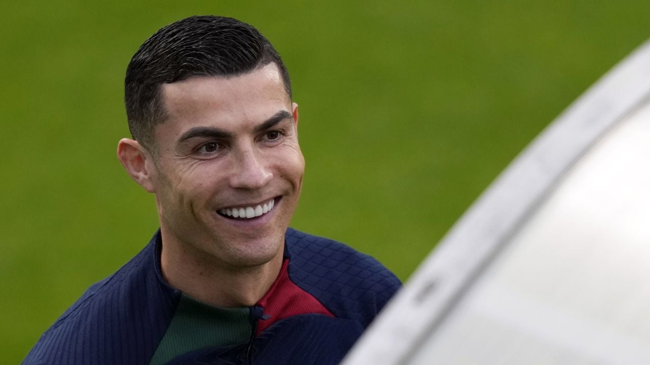 Cristiano Ronaldo smiles as he arrives for a Portugal soccer team training session in Oeiras, outside Lisbon, Monday, Nov. 14, 2022. Portugal will play Nigeria Thursday in a friendly match in Lisbon before departing to Qatar on Friday for the World Cup. (AP/Armando Franca)