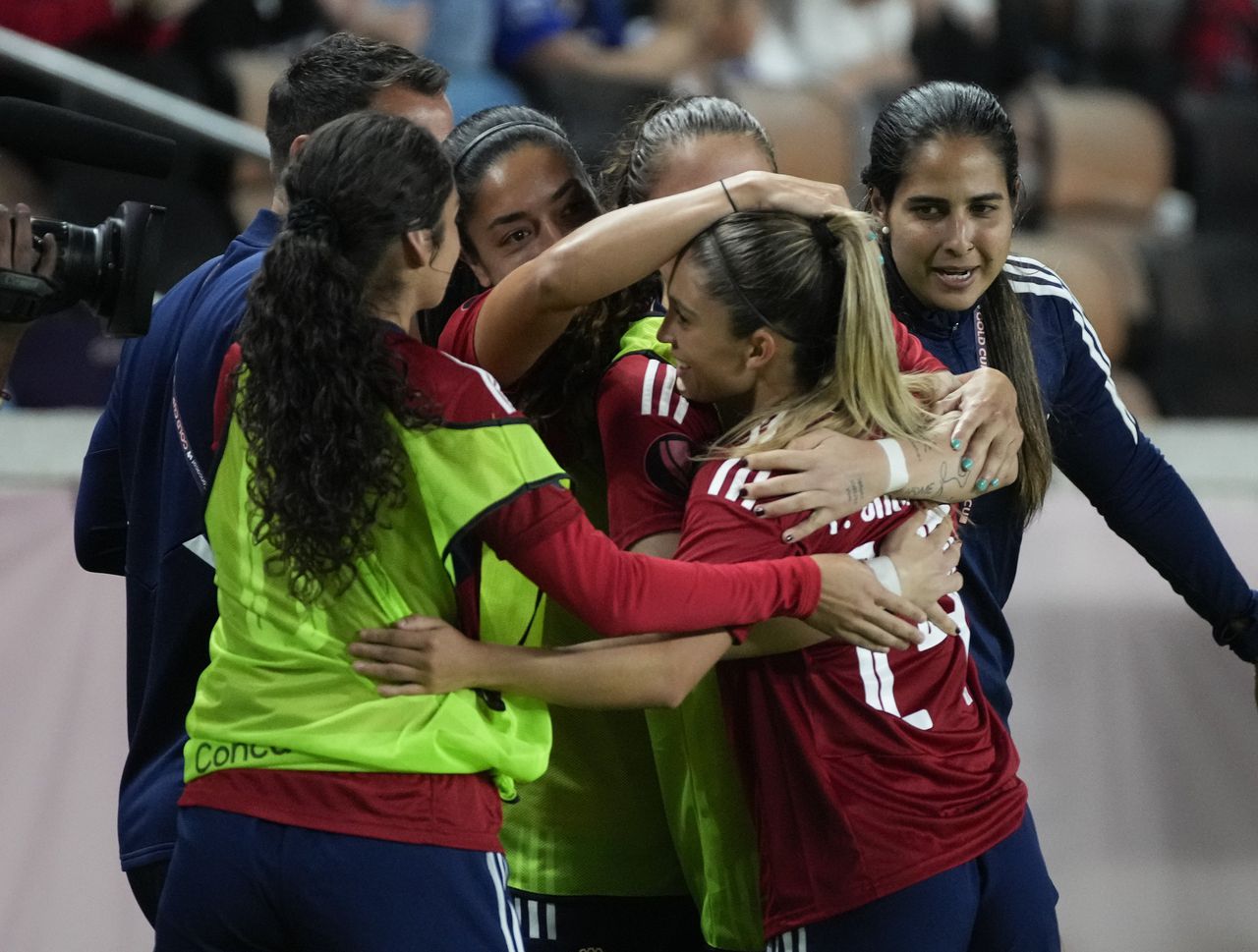 Costa Rica midfielder Priscila Chinchilla, front right, and teammates celebrate after her second goal against El Salvador during the second half of the CONCACAF W Gold Cup soccer match Sunday, Feb. 25, 2024, in Houston. (Yi-Chin Lee/Houston Chronicle via AP)