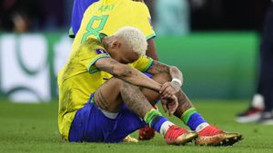 Brazil's Neymar sits on the pith after his side lost in a penalty shootout the World Cup quarterfinal soccer match between Croatia and Brazil, at the Education City Stadium in Al Rayyan, Qatar, Friday, Dec. 9, 2022. (AP Photo/Manu Fernandez)