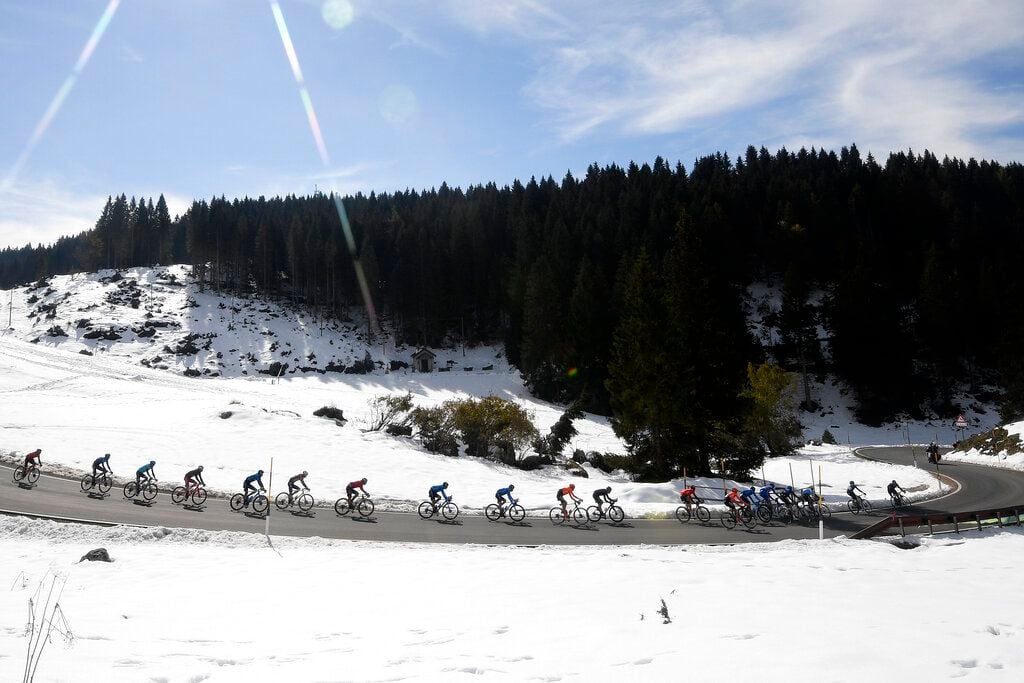 Cyclists pedal during the 17th stage of the Giro d'Italia cycling race from Bassano del Grappa to Madonna di Campiglio, northern Italy, Wednesday, Oct. 21, 2020. (Fabio Ferrari/LaPresse via AP)