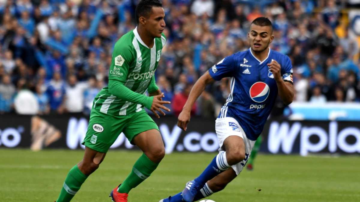 BOGOTA, COLOMBIA - MARCH 09: Jhon Duque of Millonarios vies for the ball with Brayan Rovira of Atletico Nacional during a match between Millonarios and Atlético Nacional as part of Liga Aguila 2019 at Estadio Nemesio Camacho on March 09, 2019 in Bogota, Colombia. (Photo by Getty Images/Luis Ramirez/Vizzor Image)