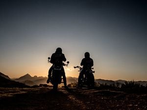 The silhouette of the riders during sunset with copy space